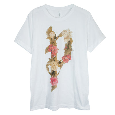 White short sleeve shirt with the letter P in the center, The letter is written with pink and white flowers, as well as some green leaves.