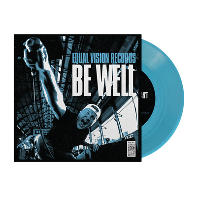 Transparent blue vinyl peeking out of a jacket. The design on the jacket has the text "EQUAL VISION RECORDS" and "BE WELL" printed in blue and white respectively. The art is an image of the vocalist raising the microphone to the camera. The entire jacket has a mono blue filter.