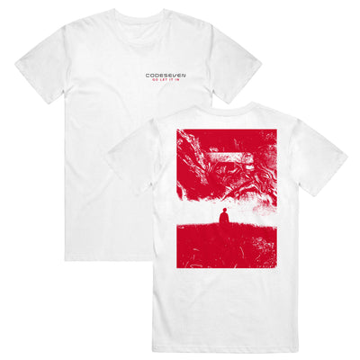 White t-shirt with the text "CODESEVEN" "GO LET IT IN" printed in black and red respectively. The print is on the top right. The Design on the back is in a hazy red color. There is the outline of a man standing in a field of grass.