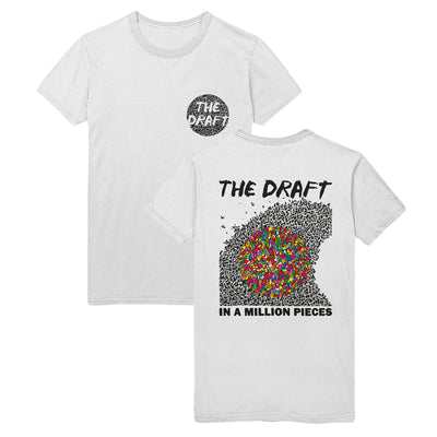 White t-shirt with the words "THE DRAFT" printed over a black circle in the top right corner of the shirt. The back of the shirt has "THE DRAFT" printed in the top center in a black font. Below that is a drawing of several different black shapes that make up a wave shape. Over this shape is a circle that is made up of more several shapes in different, bold colors. Below this drawing reads "IN A MILLION PIECES" in a bold, black font.