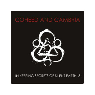 Black square sticker that has a design with triangles and circles overlapping.  There is red text that reads coheed and cambria and white text that reads in keeping secrets of silent earth: 3.