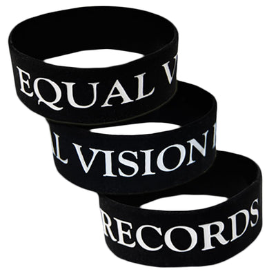 3 black wrist bands against white background. Each band has "EQUAL VISION" printed on them in white.