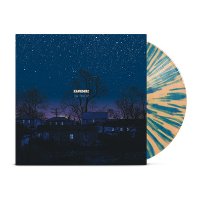 Tan-colored vinyl with blue splatter printed around it. Jacket of vinyl is a picture of a blue and purple night sky with houses, trees, telephone pole, and stars. Center of jacket has "BANE" printed with "DON'T WAIT UP" printed below it.