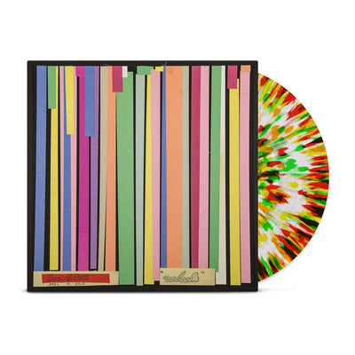 Vinyl jacket with album artwork of rainbow paper strips laying down vertically. Peeking out of the jacket is a white, yellow, red, orange, and green splattered vinyl.