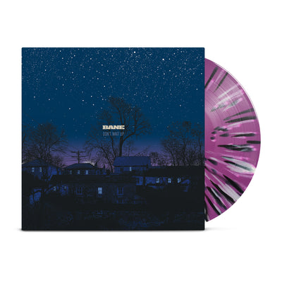 Orchid-colored vinyl with black and white splatter printed around it. Jacket of vinyl is a picture of a blue and purple night sky with houses, trees, telephone pole, and stars. Center of jacket has "BANE" printed with "DON'T WAIT UP" printed below it. 