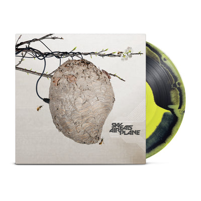 Black and yellow mix vinyl. Vinyl Jacket has picture of bees nest hanging from tree branch. 2 bees flying toward the nest. Bottom right corner has "SKY EATS AIRPLANE" printed.