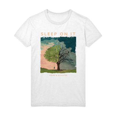 White short sleeve shirt with orange text that says SLEEP ON IT. Below the text, there is a drawing of a tree, on one side there is someone on a swing and the tree is alive, but on the other the tree is dead and has been struck by lightning. Below the drawing there is smaller orange text that says PRIDE & DISASTER.