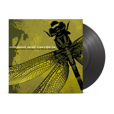 Transparent black vinyl peeking out of a dark yellow jacket. The jacket has a close up drawing of a dragonfly in the right side. It's wings mostly take up the left side of the jacket. The text "coheed and cambria" with the album name "the second stage of turbine blade." is printed on the left.