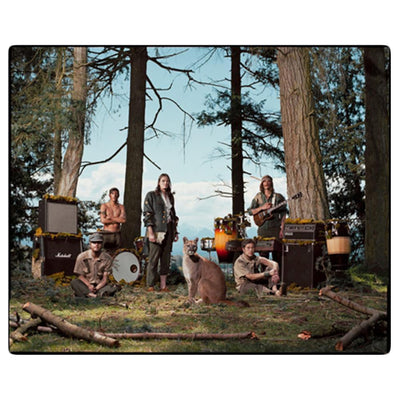 CD against white background. CD cover is a picture of The Wild Orchid Children standing outside in the woods. There is a panther standing in the center by the band members.