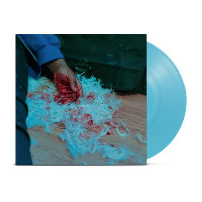 Bright blue vinyl. Jacket of vinyl is a picture of someone sitting on the ground with only their leg, arm, and hand visible in the picture. Their hand is on the wooden floor and is placed in a pile of white fur. Their hand and some of the fur is covered in blood.