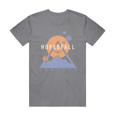 Grey short sleeve shirt with "HOPESFALL" written in white lettering across the chest. Behind that is an orange sun and a blue triangle making the shape of a mountain. There is a bird drawn over the sun in the same blue used for the mountain. Below the mountain is blue font that says "ARBITER".