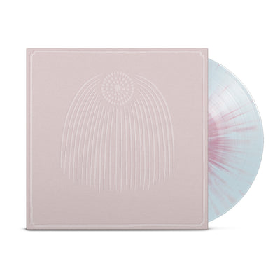 Record against white background. Vinyl is light blue with pink splatter. Vinyl jacket is a pink/tan color with simple drawing of a circle in the top center of jacket. The circle is made up of dots and several straight lines are stemming down from the circle.