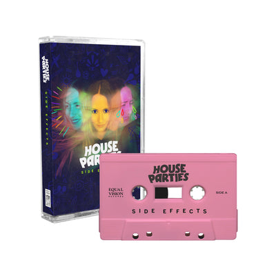 Light pink cassette tape. Cassette case has picture of 3 heads of the same girl making different faces. Face in the middle is orange, left is blue and happy and right is pink and crying. Below picture is "HOUSE PARTIES" in white font and "SIDE EFFECTS" in green font below it. 