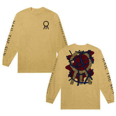 Mustard colored long-sleeve shirt. There is a small black circle on the right side with three lines coming from the bottom that look like sun rays. The left sleeve has the band name "HAIL THE SUN" in large lettering all the way down the sleeve. The right sleeve has the text "DIVINE INNER TENSION". The back of the shirt has the same circle with three lines. It is in a metallic gold color. There is red splatter behind the circle, and coiled metal going through the design.