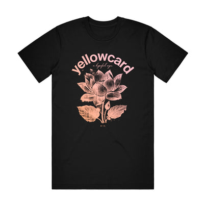 Black t-shirt with picture of lotus flower in center of shirt. "YELLOWCARD" is printed above picture in an arch, with "A HOPEFUL SIGN" printed straight across below it in small, cursive font. All printed in salmon color.