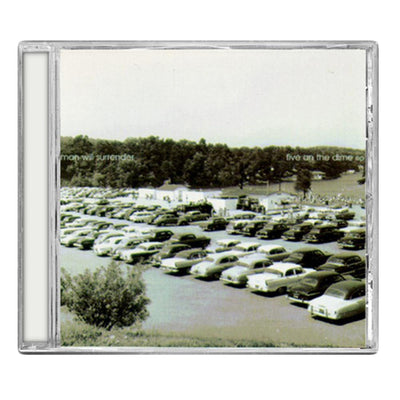 CD against white background. CD cover has a picture of cars parked in a parking lot and land and trees in the background. Picture is in black and white. In the trees is printed "MAN WILL SURRENDER" on the left side and "FIVE ON THE DIME EP" on the right side.