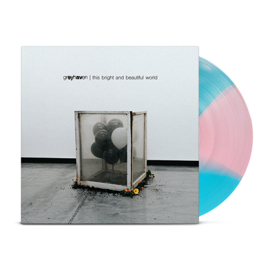 Image of record with vinyl LP showing, cover consists of a box with balloons in it, exposed disc shows alternating blue and pink color wedges